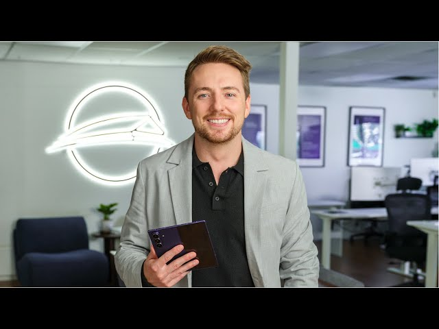 Keenan Beavis holding a foldable phone in the TELUS commercial